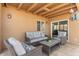 Cozy covered patio with comfortable seating, ideal for enjoying the outdoors at 7100 E Montgomery Rd, Scottsdale, AZ 85266