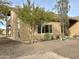 Landscaped yard with trees and desert plants surrounding a two story home at 7100 E Montgomery Rd, Scottsdale, AZ 85266