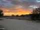 Arizona property with desert landscaping and a colorful sunset at 7100 E Montgomery Rd, Scottsdale, AZ 85266