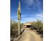 Southwestern-style home featuring desert landscaping, mature Saguaro cactus and private driveway at 7100 E Montgomery Rd, Scottsdale, AZ 85266