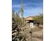 Southwestern-style home featuring desert landscaping, mature Saguaro cactus and private driveway at 7100 E Montgomery Rd, Scottsdale, AZ 85266