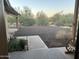 View of a landscaped front yard with drought-resistant plants from a covered porch of a desert home at 7100 E Montgomery Rd, Scottsdale, AZ 85266