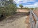 View of a horse paddock with desert landscaping and clear blue sky at 7100 E Montgomery Rd, Scottsdale, AZ 85266