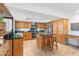 Kitchen with wooden cabinets, stainless steel appliances, granite countertops, and kitchen island at 7100 E Montgomery Rd, Scottsdale, AZ 85266