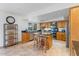 Well-lit kitchen with stainless steel appliances, granite countertops, and an island with seating at 7100 E Montgomery Rd, Scottsdale, AZ 85266