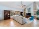 Comfortable living room with natural light, built-in shelving, and a stylish gray sectional sofa at 7100 E Montgomery Rd, Scottsdale, AZ 85266