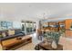 Spacious living room open to kitchen featuring sliding glass doors to the outside at 7100 E Montgomery Rd, Scottsdale, AZ 85266