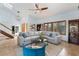 Relaxing living room featuring a gray sectional, modern lighting, and a beautiful area rug at 7100 E Montgomery Rd, Scottsdale, AZ 85266