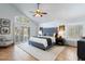 Charming main bedroom with vaulted ceilings, window shutters, neutral decor, and tile flooring at 7100 E Montgomery Rd, Scottsdale, AZ 85266