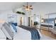 Bright main bedroom showcasing vaulted ceilings, closet with mirrored doors, and contemporary decor at 7100 E Montgomery Rd, Scottsdale, AZ 85266