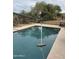 Outdoor pool features a rope swing and desert landscaping at 7100 E Montgomery Rd, Scottsdale, AZ 85266