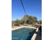 Backyard pool with desert landscaping and a seating area, perfect for outdoor relaxation at 7100 E Montgomery Rd, Scottsdale, AZ 85266