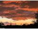 Beautiful colorful sunset over the mountains and desert landscape with saguaros and trees at 7100 E Montgomery Rd, Scottsdale, AZ 85266