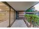 Relaxing outdoor balcony featuring tiled floor and wood slat wall detail at 7121 E Rancho Vista Dr # 5011, Scottsdale, AZ 85251