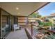 Outdoor patio area overlooking the community courtyard with views of the building's exterior at 7121 E Rancho Vista Dr # 5011, Scottsdale, AZ 85251