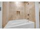 Bathroom with a soaking tub and neutral tile surround at 7121 E Rancho Vista Dr # 5011, Scottsdale, AZ 85251