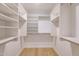 Walk-in closet with custom shelving and hanging space at 7121 E Rancho Vista Dr # 5011, Scottsdale, AZ 85251