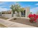 Charming single-story home featuring desert landscaping with blooming red bougainvillea and decorative gravel at 7126 N Via Nueva --, Scottsdale, AZ 85258