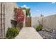 Beautifully landscaped walkway leading to a private entrance with desert plants and decorative rock at 7126 N Via Nueva --, Scottsdale, AZ 85258