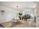 Open-concept living room with contemporary decor including a modern dining table and chairs at 7126 N Via Nueva --, Scottsdale, AZ 85258