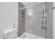 Modern bathroom featuring a glass shower, toilet, and tile walls at 7905 W Thunderbird Rd # 308, Peoria, AZ 85381