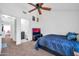 Comfortable bedroom with natural light, neutral carpet and ceiling fan at 7905 W Thunderbird Rd # 308, Peoria, AZ 85381