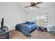 Cozy bedroom with neutral carpet, ceiling fan and a bright window view at 7905 W Thunderbird Rd # 308, Peoria, AZ 85381