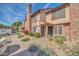 A well-kept townhouse complex features desert landscaping and a charming two-story design at 7905 W Thunderbird Rd # 308, Peoria, AZ 85381