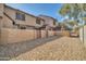 Townhome exterior with a gravel backyard and a block wall fence for privacy at 7905 W Thunderbird Rd # 308, Peoria, AZ 85381