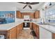 Spacious kitchen with white countertops, wooden cabinets and white appliances at 7905 W Thunderbird Rd # 308, Peoria, AZ 85381