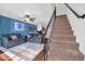 Inviting living room features modern furnishings, a cozy seating arrangement, and an adjacent staircase at 7905 W Thunderbird Rd # 308, Peoria, AZ 85381