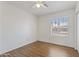 Bedroom featuring neutral walls, laminate flooring, ceiling fan, and lots of light at 840 E Hackamore St, Mesa, AZ 85203