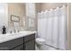 Well-lit bathroom with vanity, mosaic tile backsplash, and shower-tub combination at 8418 W Louise Ct, Peoria, AZ 85383