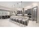 Spacious eat-in kitchen featuring gray cabinets, a large granite island, and stainless steel appliances at 8418 W Louise Ct, Peoria, AZ 85383