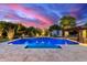 Backyard features a beautiful in-ground pool, mature trees, and a cabana at 8418 W Louise Ct, Peoria, AZ 85383