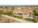 Desert home with a pool, landscaped yard, and cozy outdoor patio area at 9955 E Celtic Dr, Scottsdale, AZ 85260