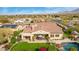 Backyard view of a desert home featuring a pool, stone patio, and beautiful mountain views at 9955 E Celtic Dr, Scottsdale, AZ 85260