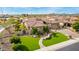 Inviting front exterior featuring a well-manicured lawn, stone accents, and a charming walkway at 9955 E Celtic Dr, Scottsdale, AZ 85260