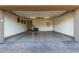 Spacious three car garage with epoxy flooring and ample storage space at 9955 E Celtic Dr, Scottsdale, AZ 85260