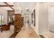 Hallway featuring stone accents, tile floors, and an open floor plan at 9955 E Celtic Dr, Scottsdale, AZ 85260