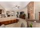 Spacious main bedroom with a stone fireplace, wooden furniture, and an inviting atmosphere at 9955 E Celtic Dr, Scottsdale, AZ 85260