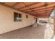 Covered patio featuring rocking chairs, accessible from the main house's exterior at 1004 S Ironwood Dr, Apache Junction, AZ 85120