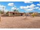 Spacious backyard features low-maintenance landscaping and ample room for outdoor activities at 1004 S Ironwood Dr, Apache Junction, AZ 85120