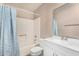 Standard bathroom featuring a shower-tub combo with blue curtain and white vanity at 1004 S Ironwood Dr, Apache Junction, AZ 85120