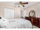 Cozy bedroom featuring tiled floors and ceiling fan at 1004 S Ironwood Dr, Apache Junction, AZ 85120