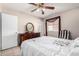 Comfortable bedroom with tiled floors, ceiling fan at 1004 S Ironwood Dr, Apache Junction, AZ 85120