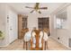 Traditional dining room with tile flooring, decorative cabinet and a ceiling fan at 1004 S Ironwood Dr, Apache Junction, AZ 85120