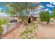 Charming single-story home with mature tree and desert landscaping in a friendly neighborhood at 1004 S Ironwood Dr, Apache Junction, AZ 85120