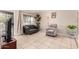 Cozy living room with tile floors and a large window providing natural light at 1004 S Ironwood Dr, Apache Junction, AZ 85120