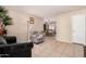 Spacious living room showcasing neutral walls and tile flooring at 1004 S Ironwood Dr, Apache Junction, AZ 85120